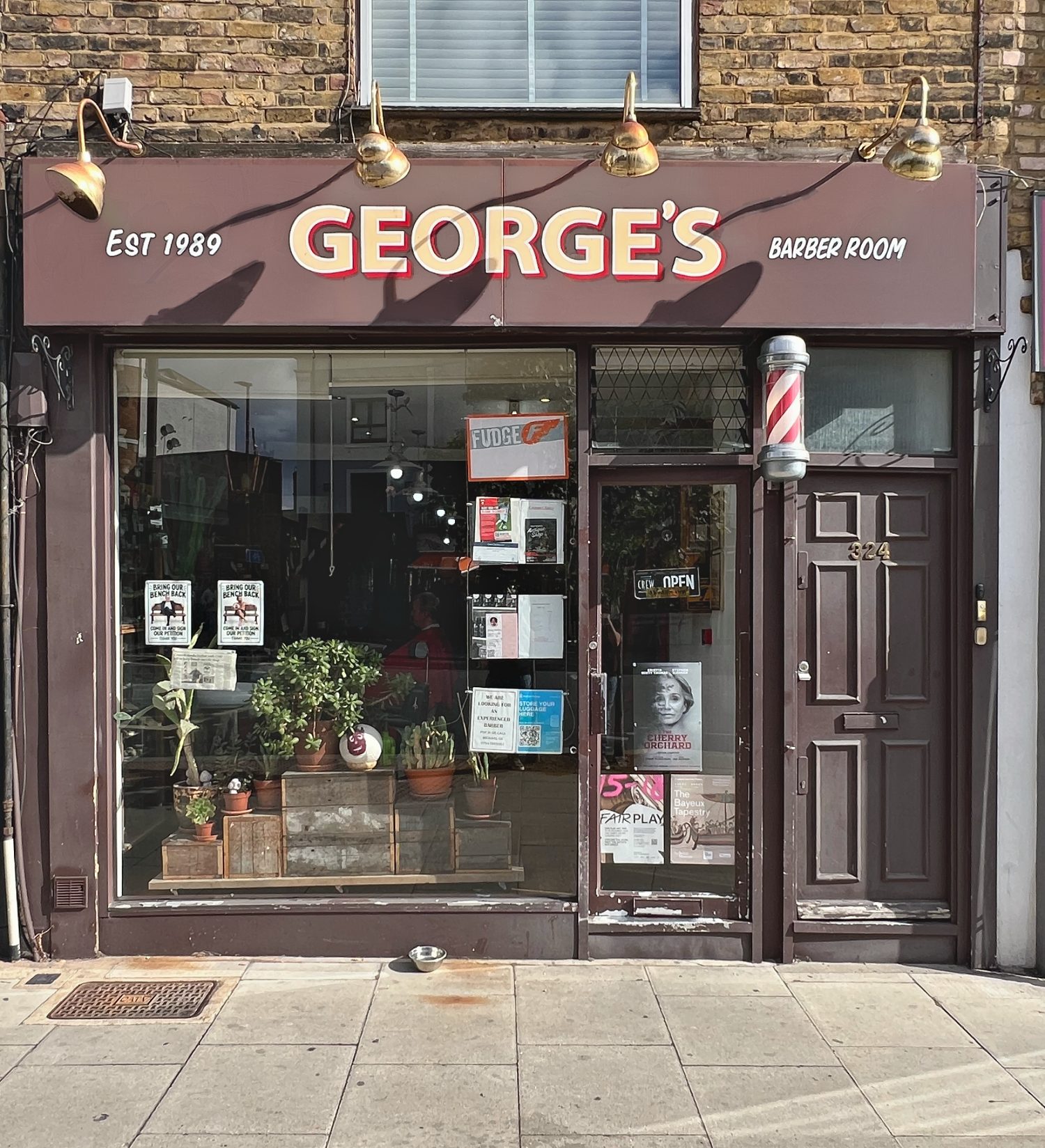 George's Barber Room shopfront with traditional barber pole at 324 Kentish Town Road, London NW5